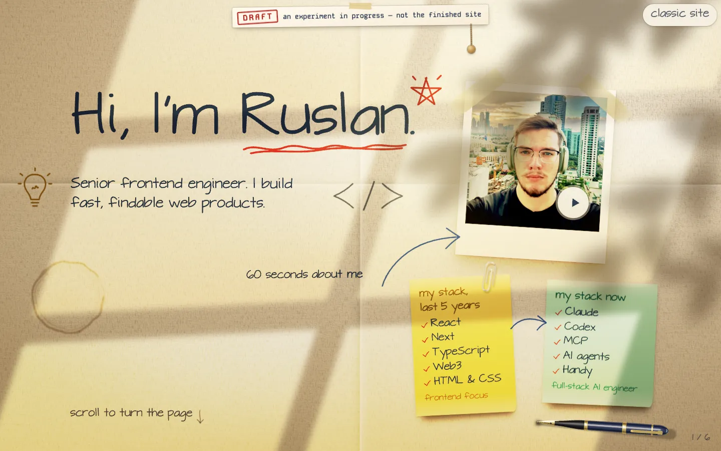 Desktop view of /v2: a sheet of paper with a handwritten heading, a polaroid photo and two sticky notes.